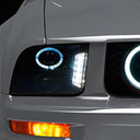 Raxiom 05-09 Ford Mustang w/ Halogen LED Halo Prjctr Headlights-Blk Hsng(Smoked Lens Exclude GT500)